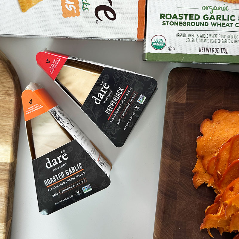 a charcuterie board with Darë vegan cheese.