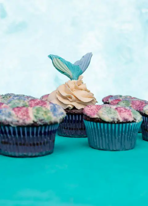 vegan salted caramel cupcakes with mermaid scale frosting.