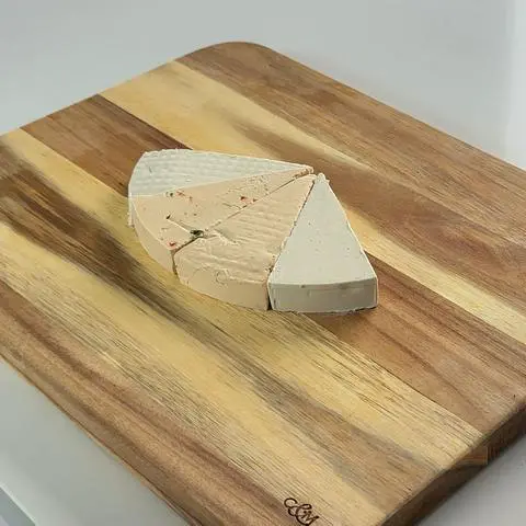 4 vegan cheese wedges pushed together.