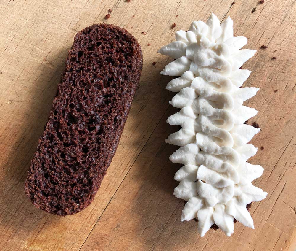 vegan chocodile teeth piped onto the bottom layer