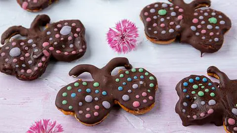 chocolate peanut butter pretzels decorated to look like butterflies.