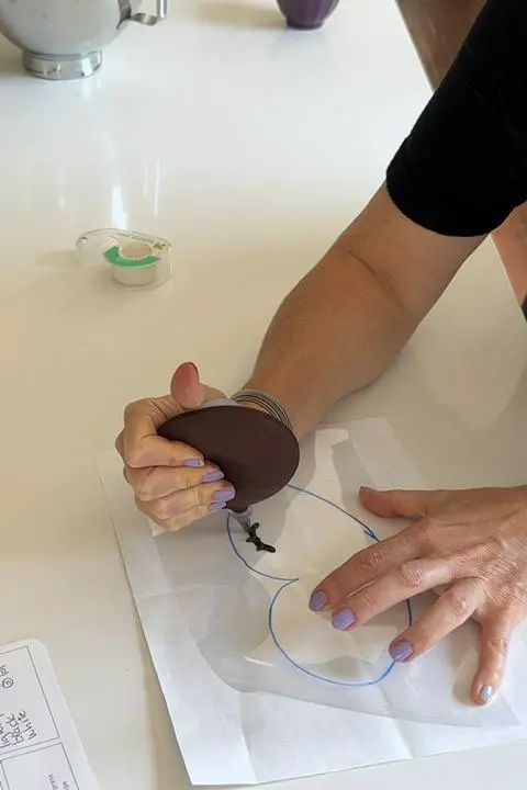 piping the reindeer facial features onto the acetate.