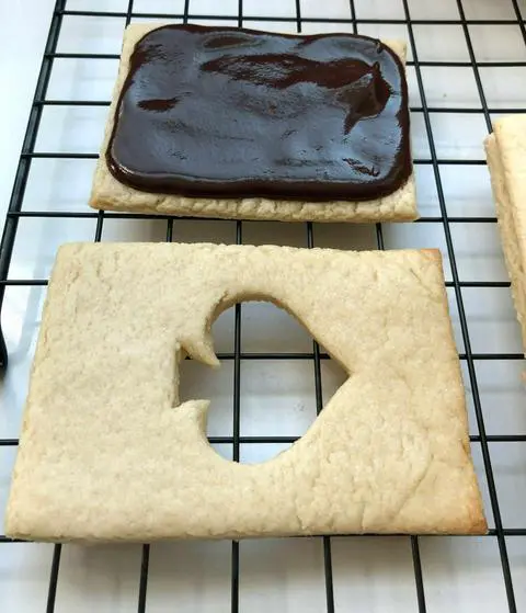 spreading vegan chocolate ganache on my playing card cookies