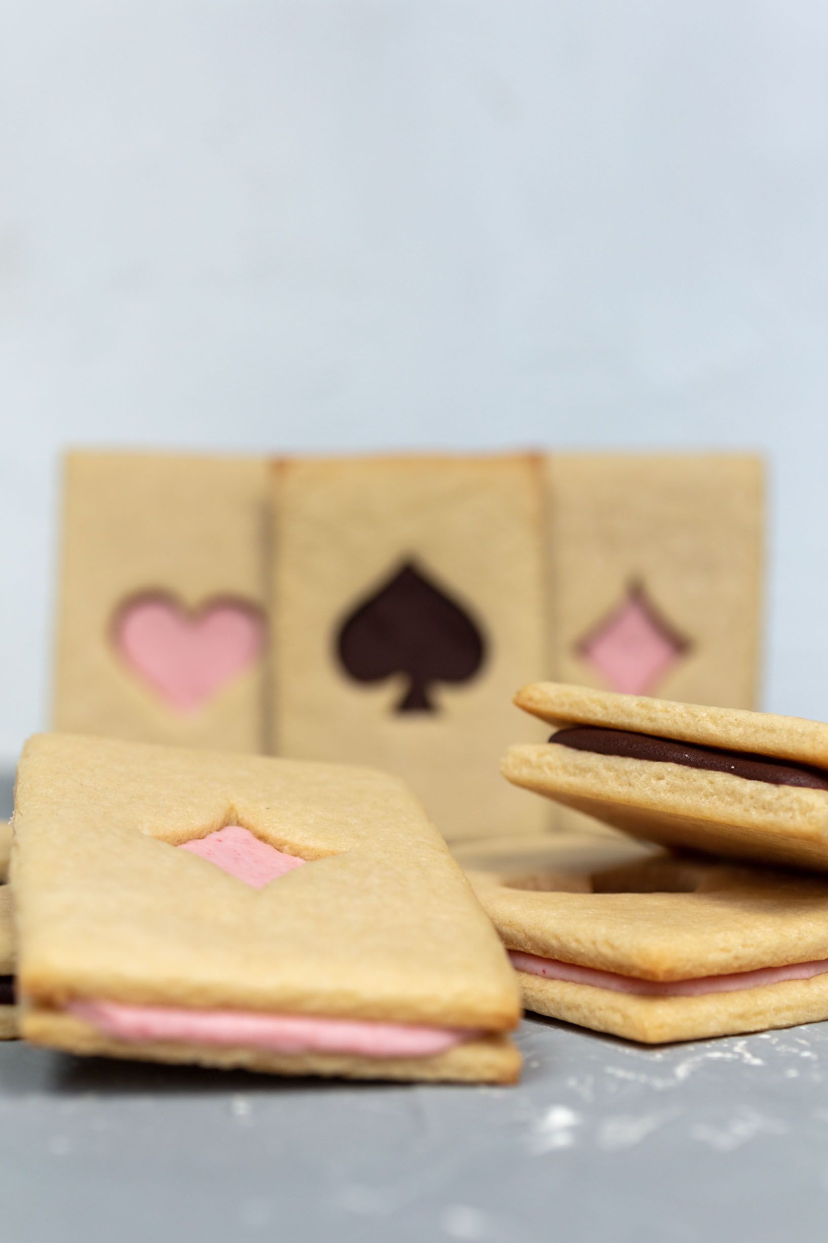 a group of vegan cookies inspired by a deck of cards