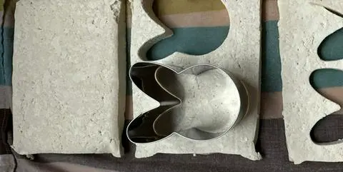 cutting out bunny shapes from tofu slices