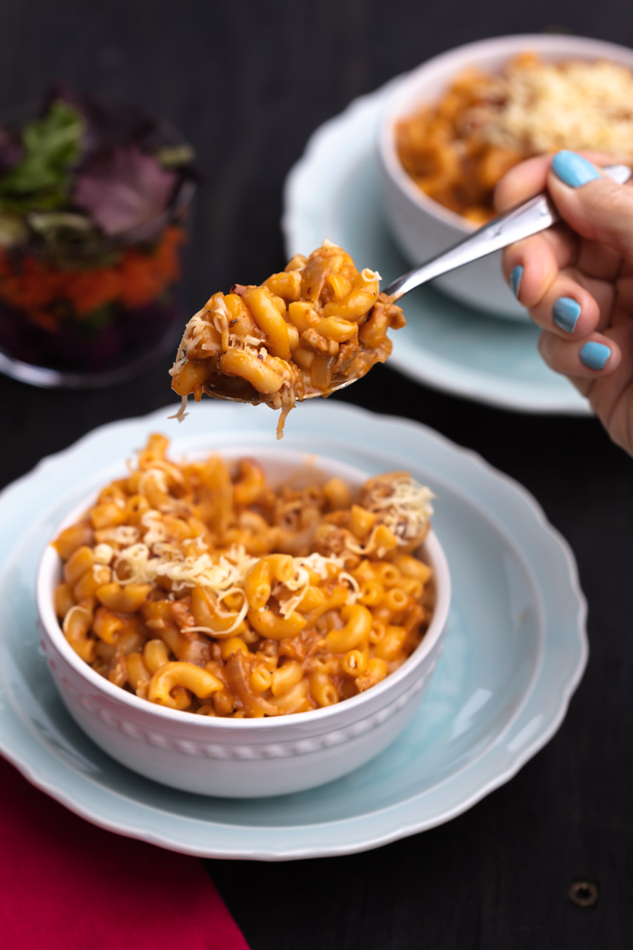 taking a bite of vegan hamburger helper