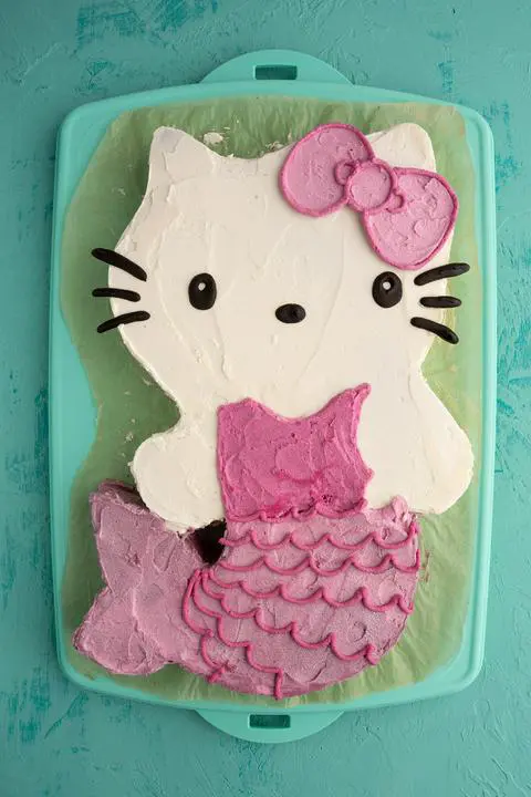 Hello Kitty mermaid cake with a pink and purple glittery tail.
