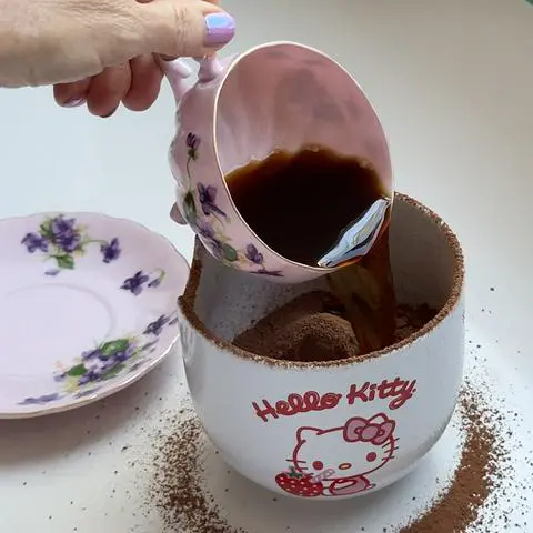 pouring hot coffee into the sifted cocoa powder.