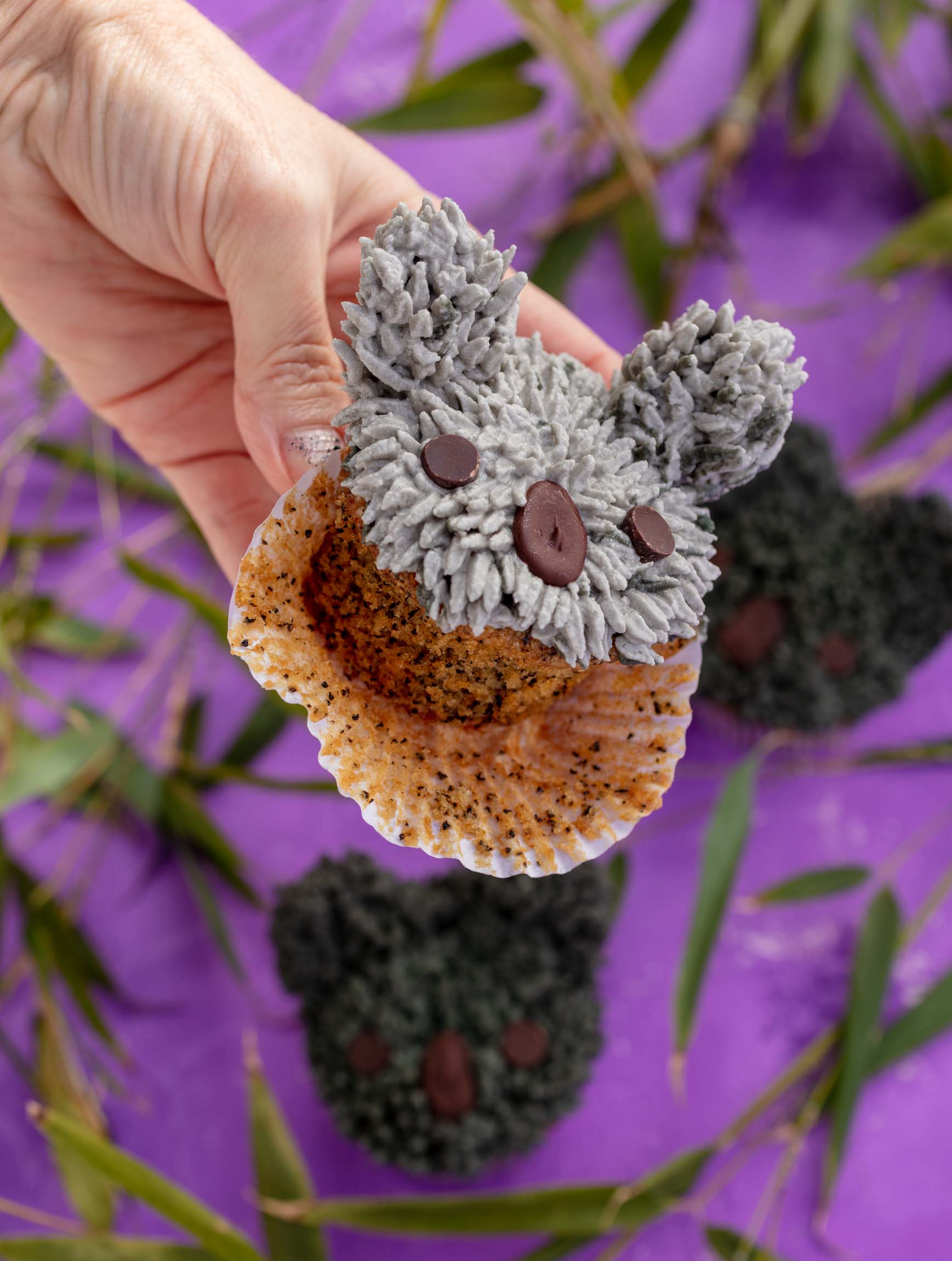 peeling the cupcake paper off a koala cupcake