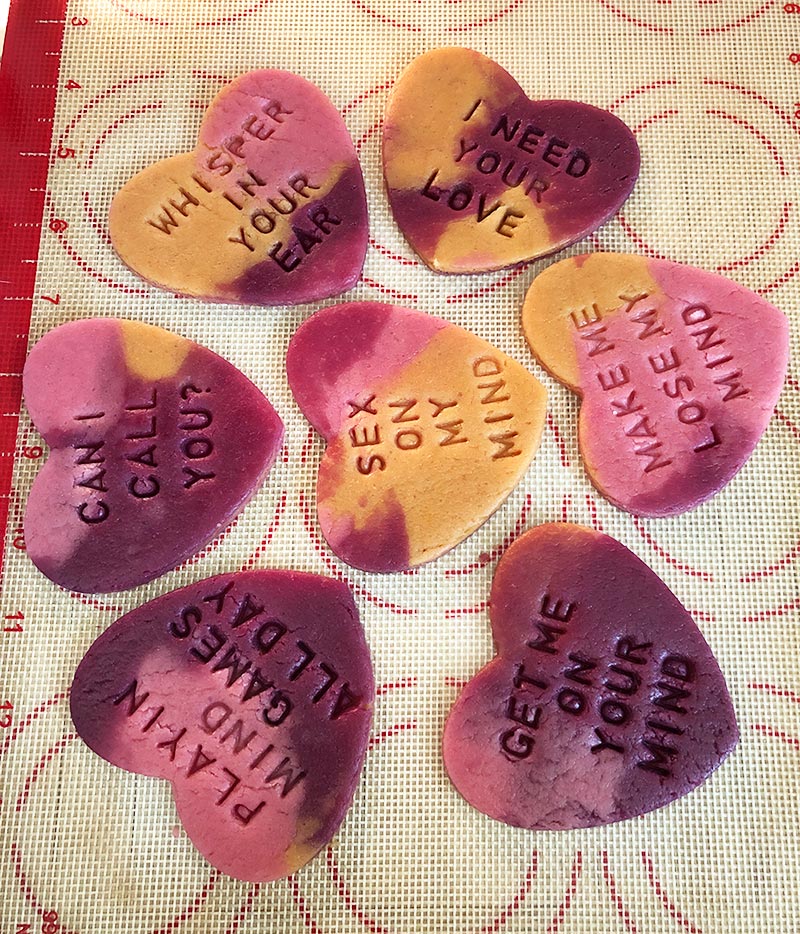 vegan conversation heart cookies stamped with cute messages