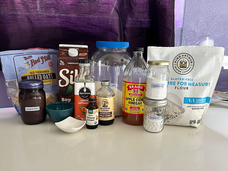 Ingredients needed to make vegan gluten-free chocolate cake.