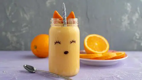 a vegan gluten-free orange julius decorated to look like a unicorn fox.