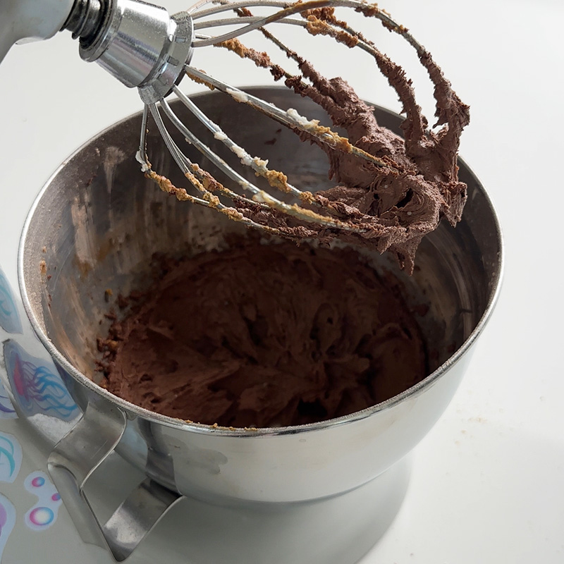 vegan chocolate frosting on the stand mixer whisk attachment.