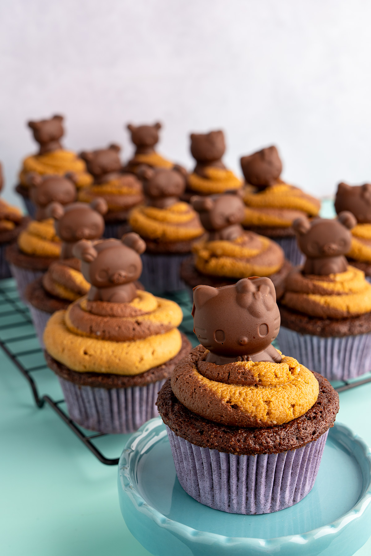 Gluten-free Vegan Peanut Butter filled cupcake with a hello kitty peanut butter cup on top.