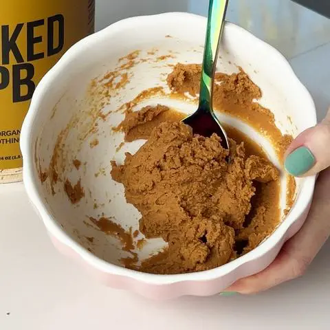 a bowl of peanut butter filling that looks like the consistency of cookie dough.