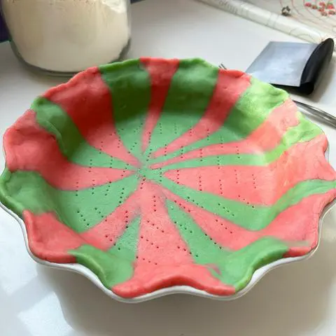 pink and green vegan pie crust in a candy swirl pattern