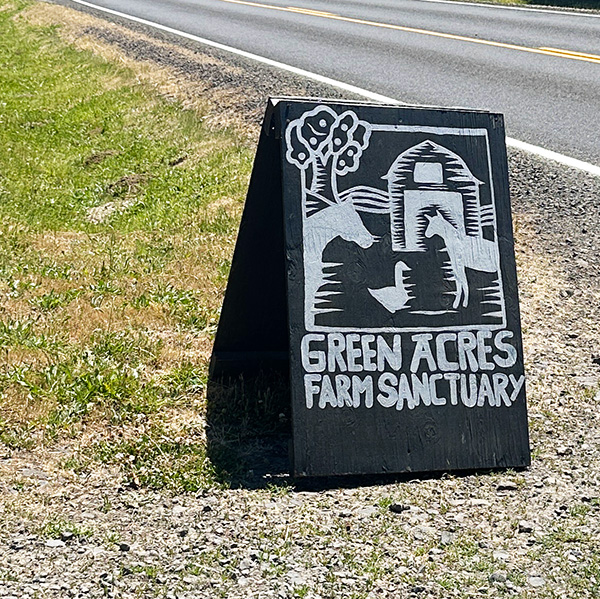 sign at the road at the driveway to Green Acres Farm Sanctuary near Portland.