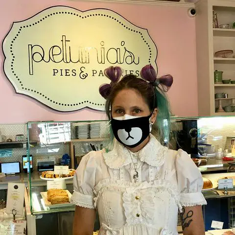me in front of the pastry case at Petunia's in Portland.