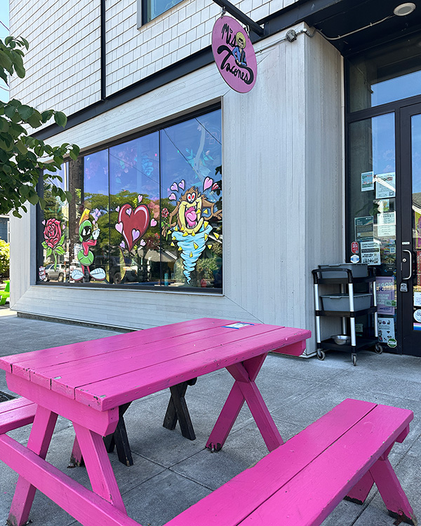 Outdoor seating in front of Mis Tacones in Portland, OR.