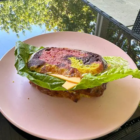 vegan sandwich made with naturally-colored rainbow bread.