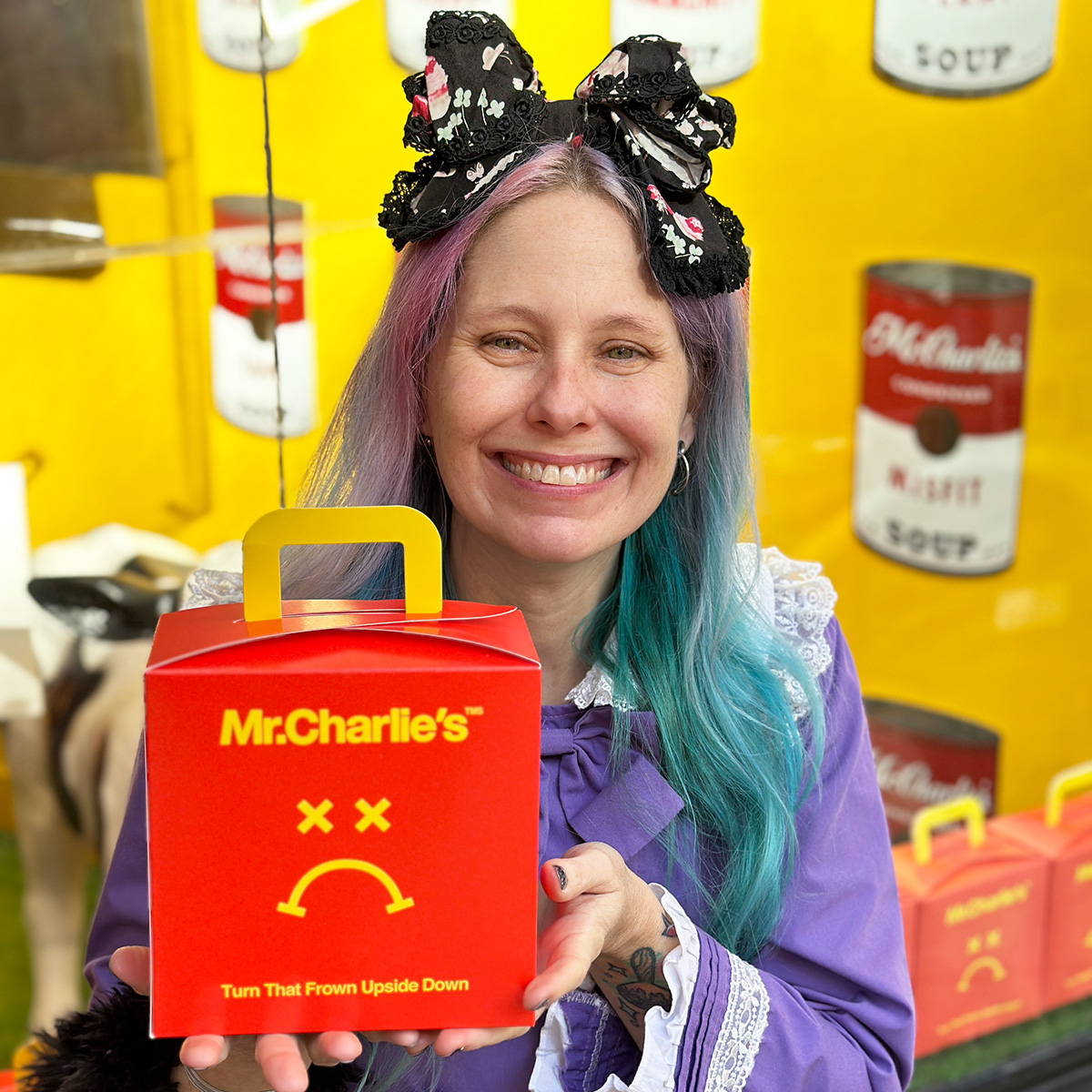 Holding a Mr. Charlies frowny meal.