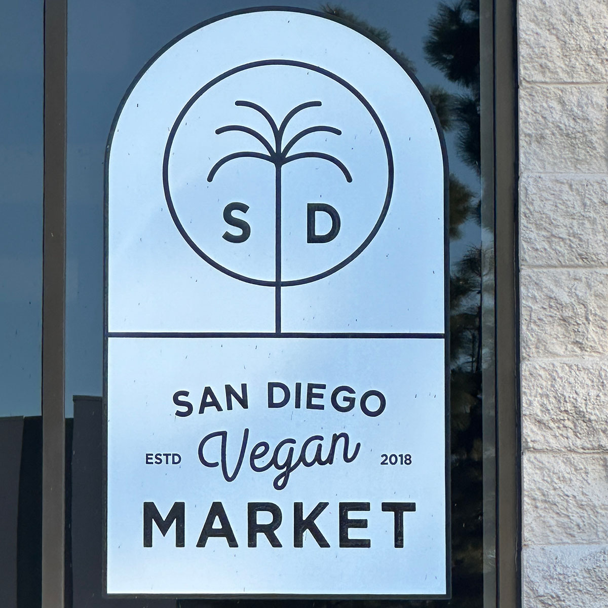 sign outside the San Diego Vegan Market in San Diego.