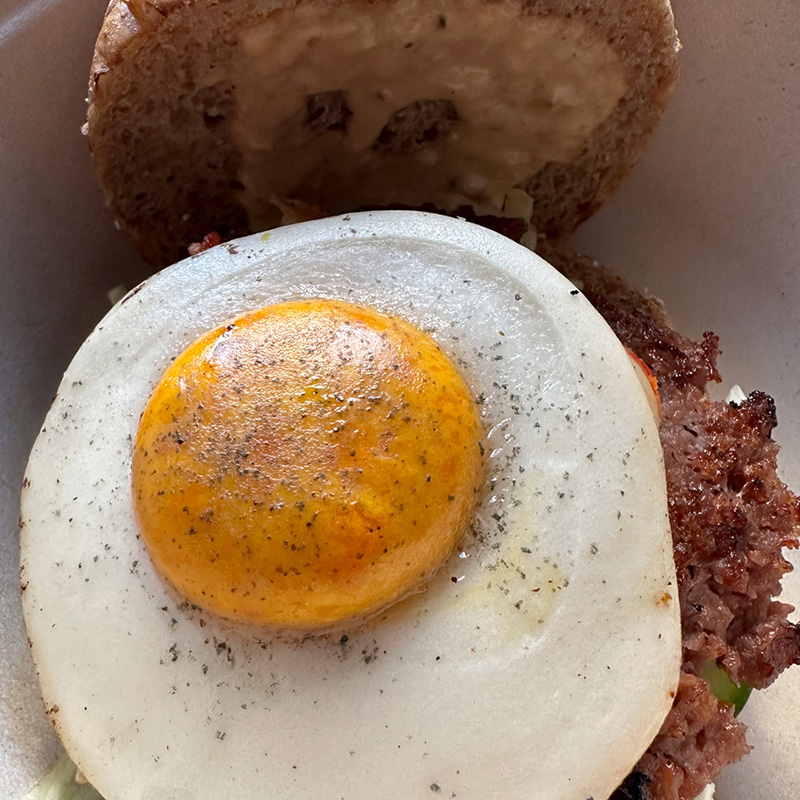 vegan burger with a vegan egg on it from Veggie Grill in Carlsbad.