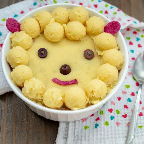 vegan shepherds pie decorated to look like a sheep.