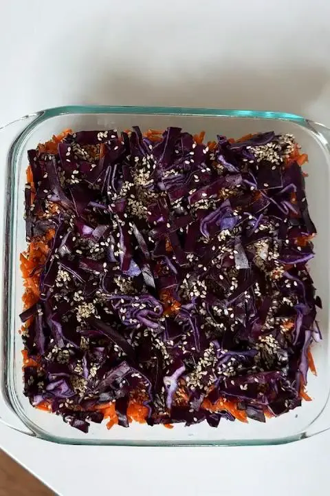 sprinkling some sesame seeds.