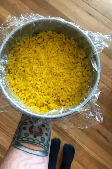 turmeric sushi rice in a cake pan