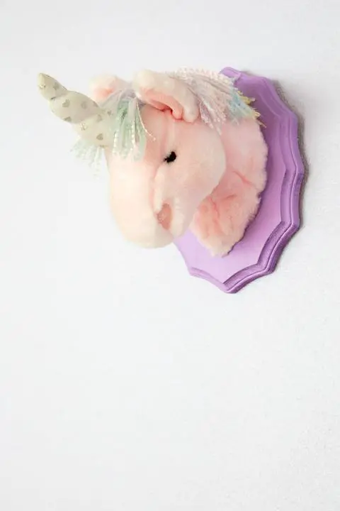 mounted stuffed unicorn head