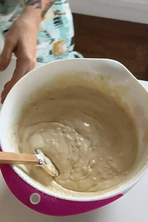 folding the vinegar into the cake batter.